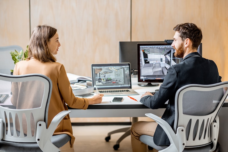 colleagues talking at an architecture firm